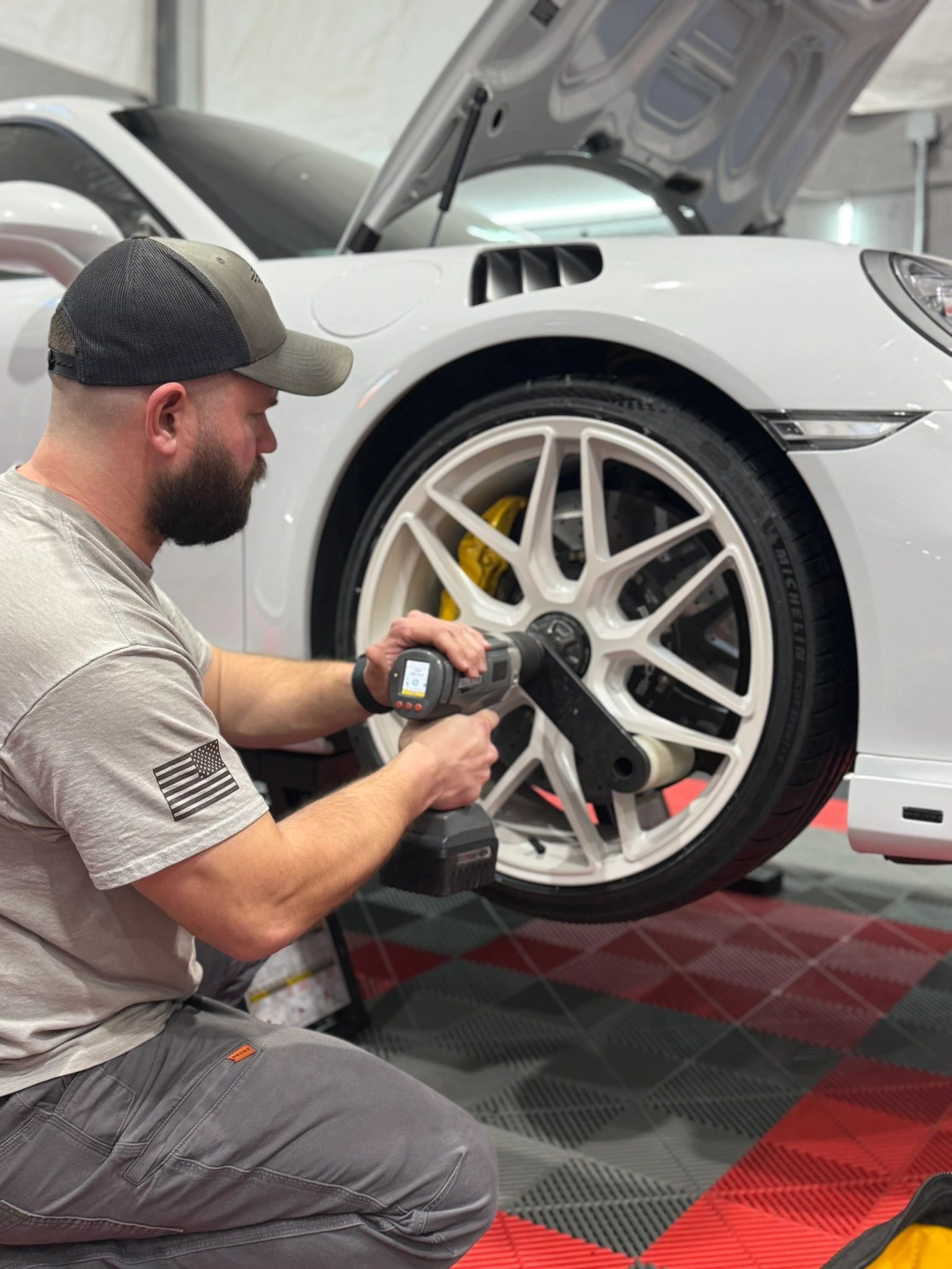 Charlie servicing a Porsche center-lock wheel
